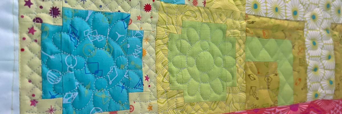 Pastel Quilt sewn and quilted by Butcher Street Quilting